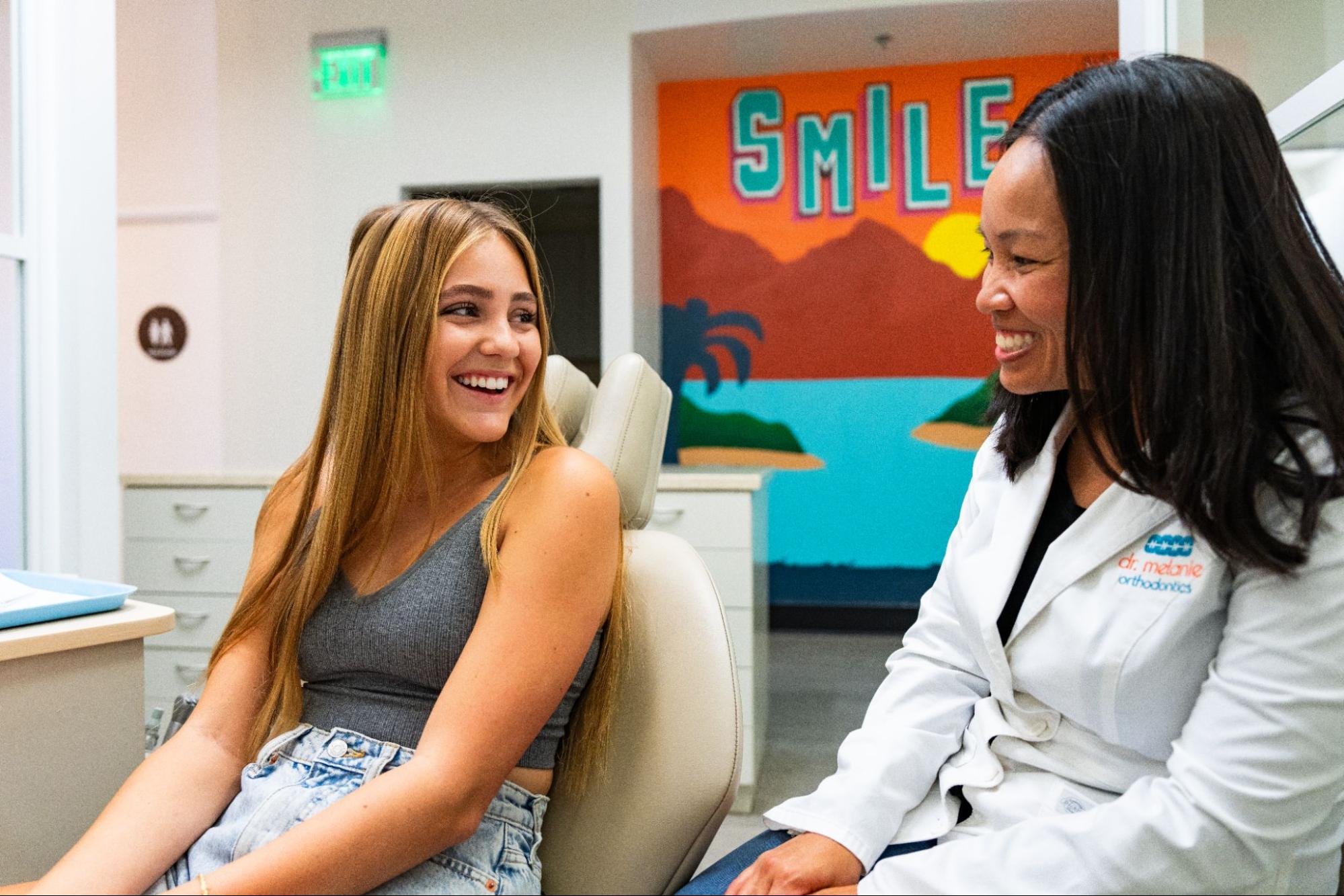 teenage patient smiling after a consultation for braces in San Diego orthodontic office